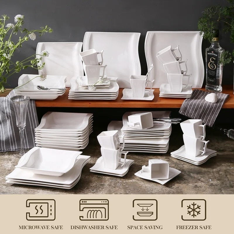 Dinner plates and side plates arranged as a place setting
