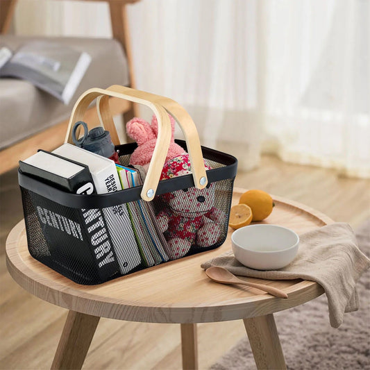 Black storage basket on living room shelf for organizing books and toys