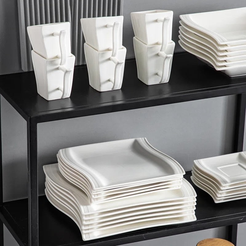 Dinner plates and side plates arranged as a place setting