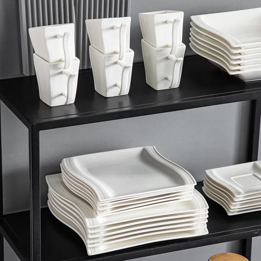 Dinner plates and side plates arranged as a place setting