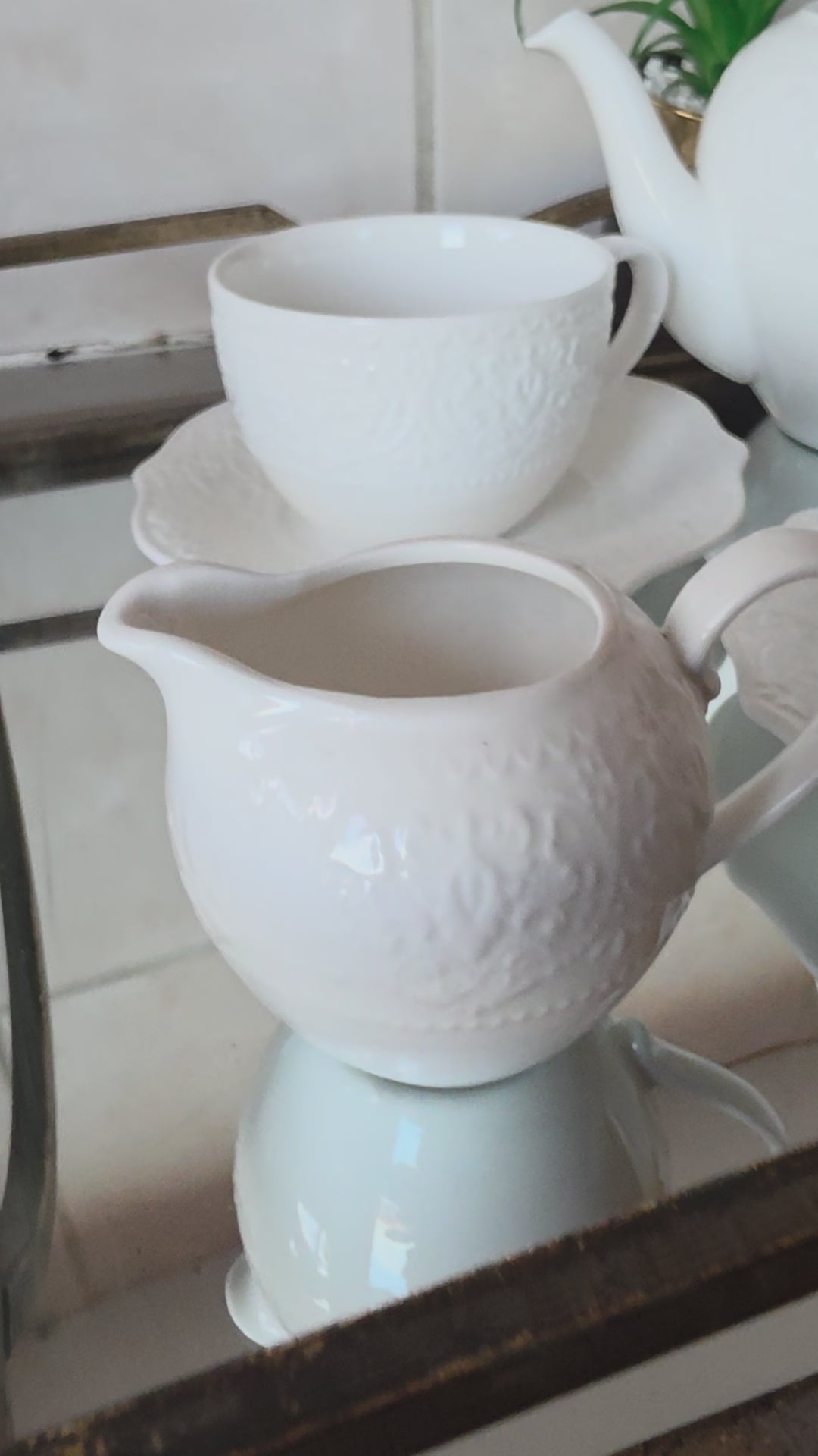 Coordinated cups and saucers from 14-piece tea set stacked together