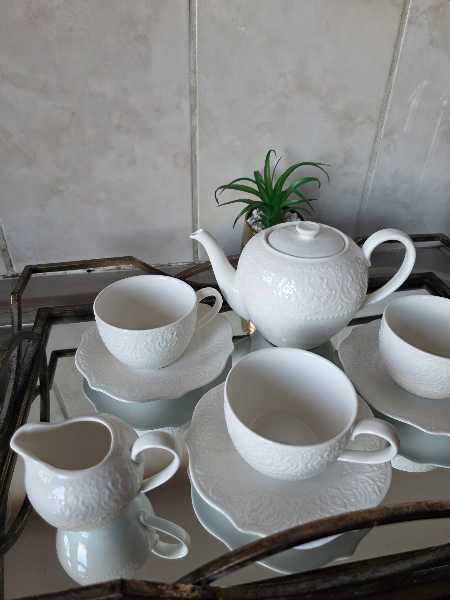 Coordinated cups and saucers from 14-piece tea set stacked together