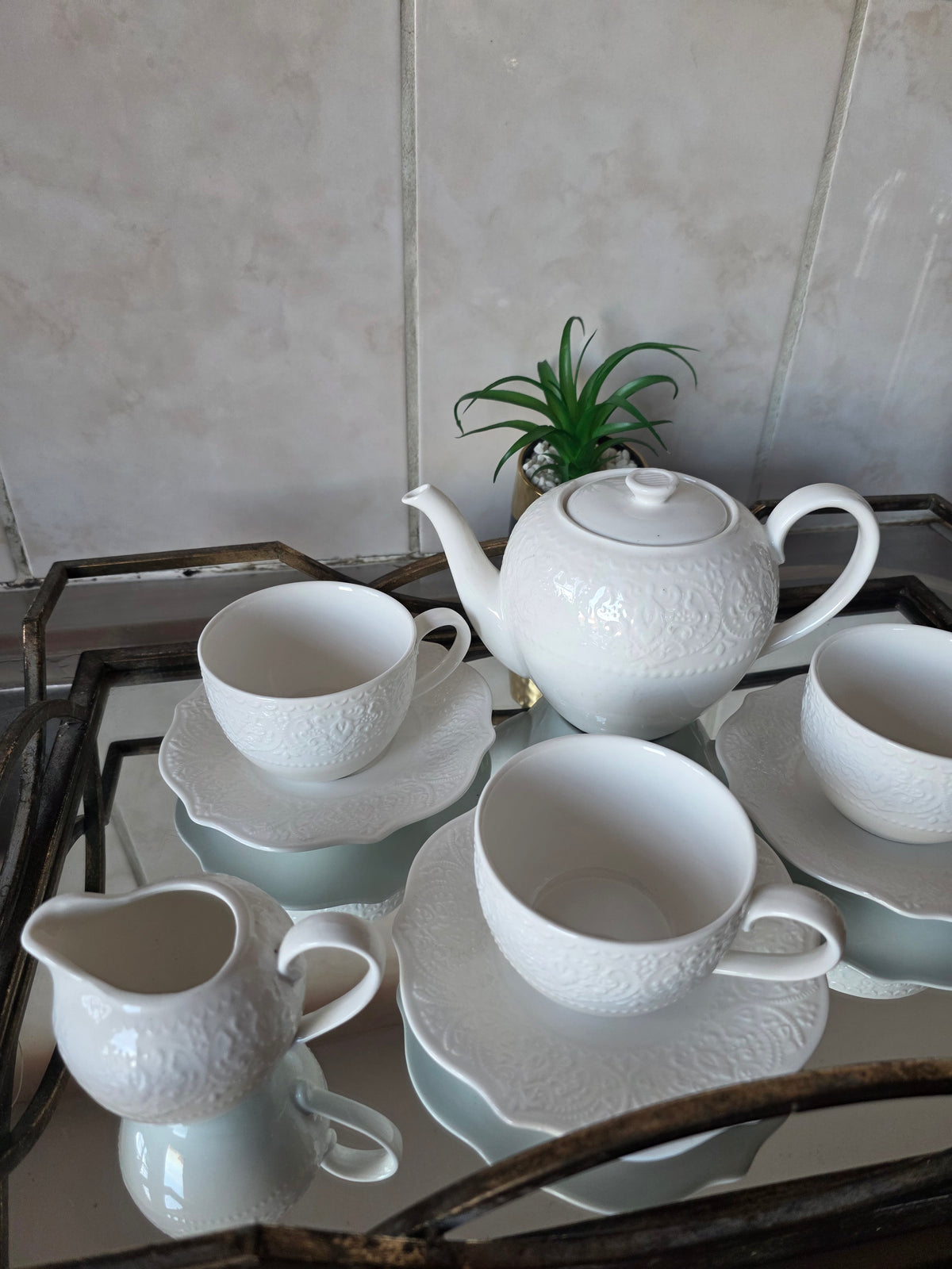 Coordinated cups and saucers from 14-piece tea set stacked together