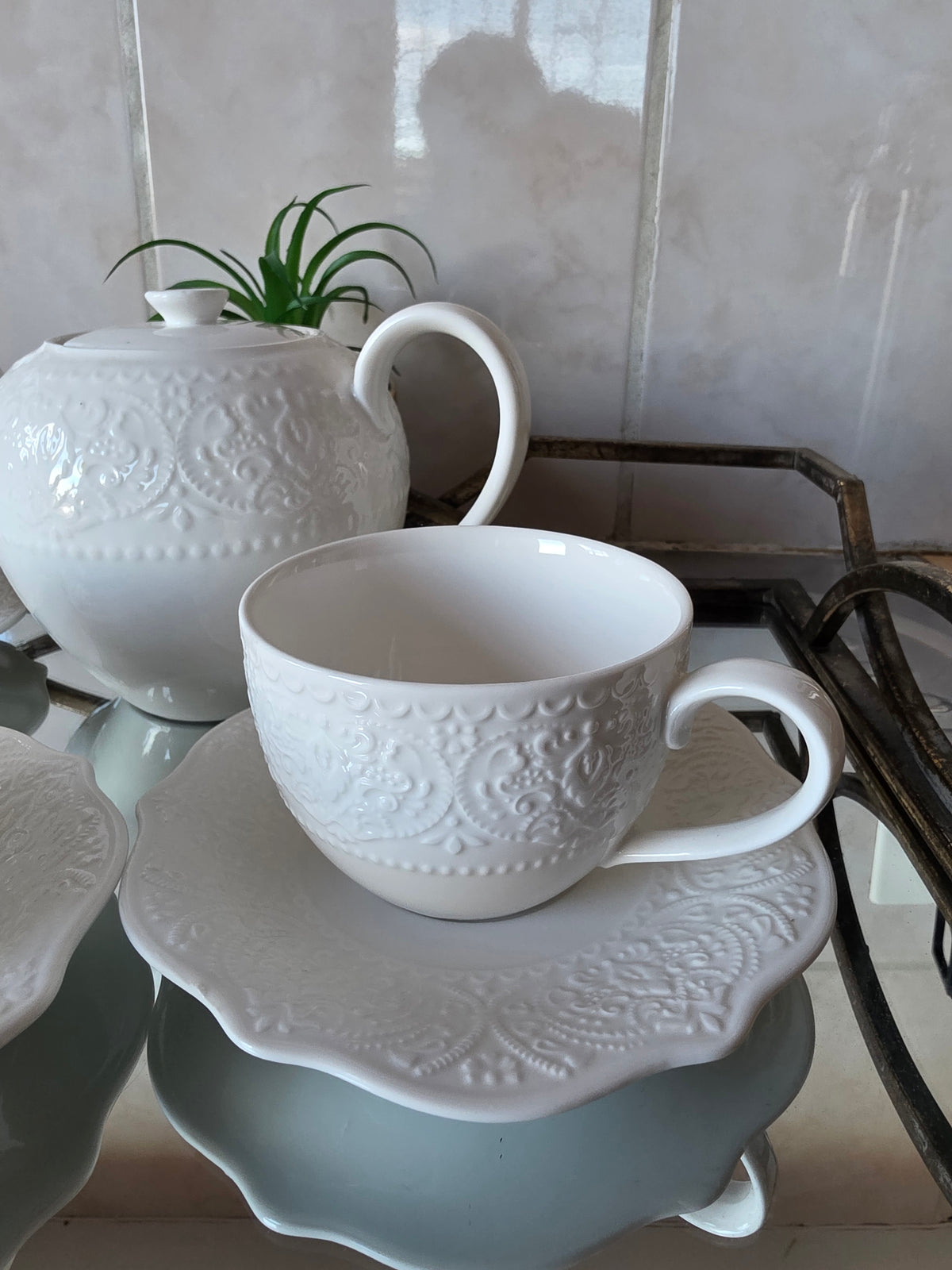 Coordinated cups and saucers from 14-piece tea set stacked together