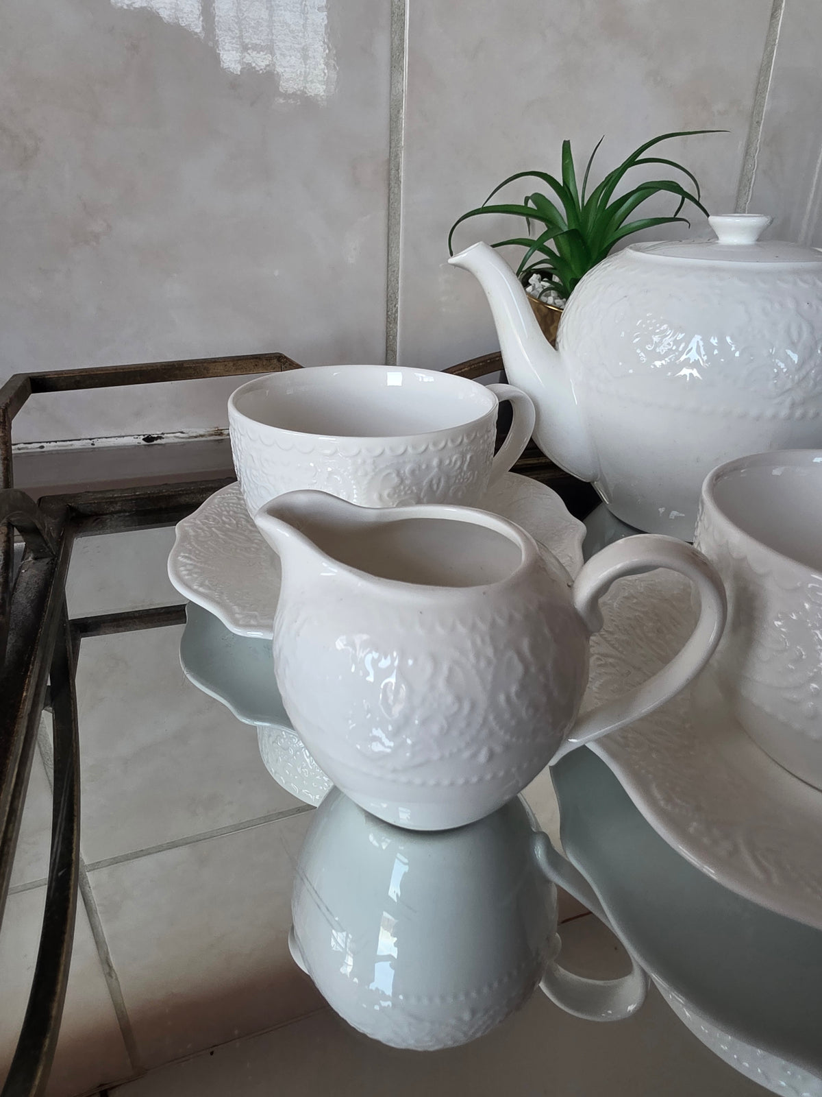 Coordinated cups and saucers from 14-piece tea set stacked together